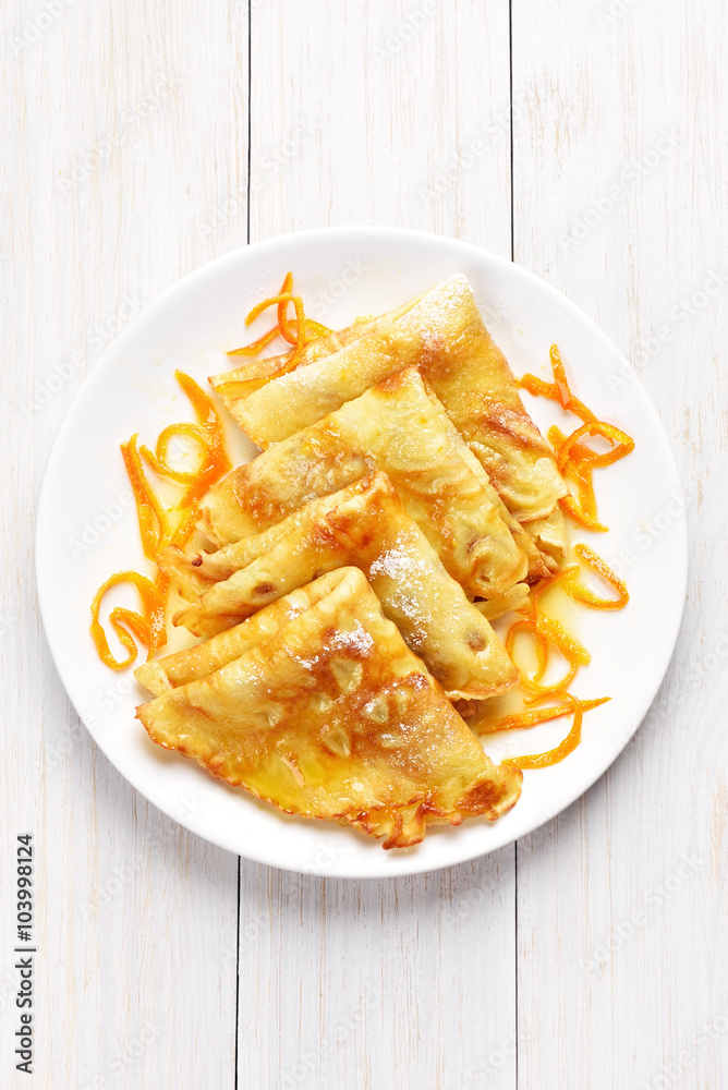 Crepes with orange sauce