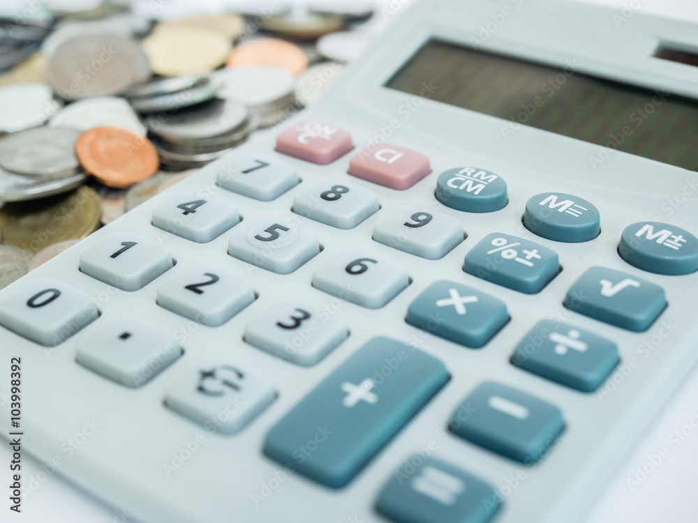 Business concept with calculator and coins. Business concept with calculator and coins.