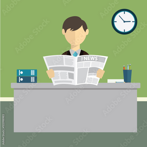 Businessman reading newspaper in office