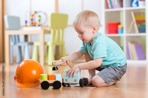 child boy toddler playing w...
