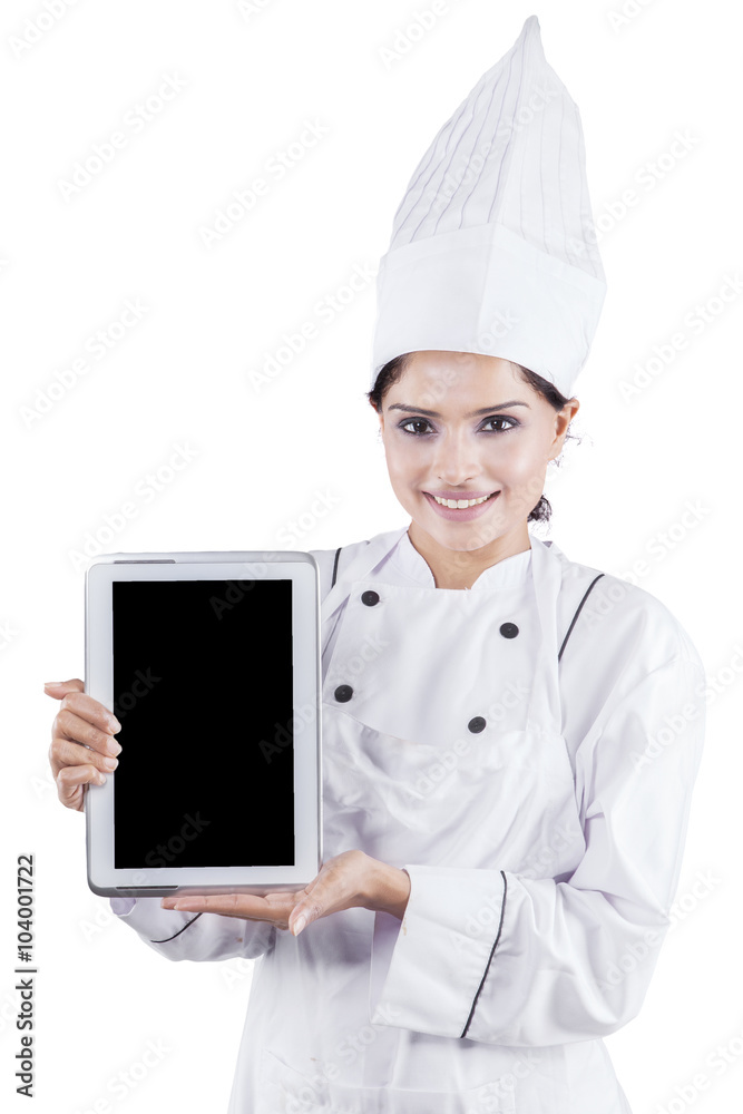 Female chef shows digital tablet Female chef shows digital tablet
