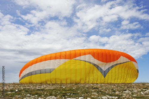 Paraglider canopy on the ground before a take-off