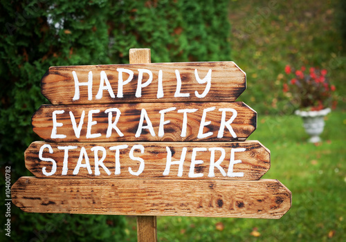 Valokuva Happily ever after sign on wooden board - wedding venue or honeymoon sign