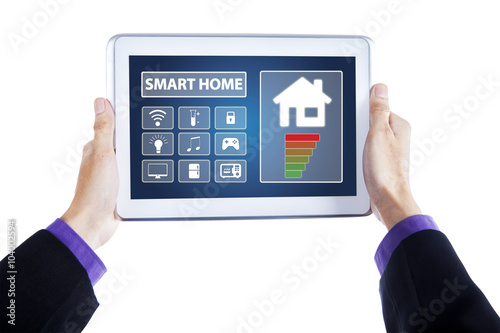 Hands with smart home controller system on tablet