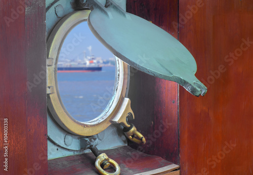 Window of boat / Window or porthole of boat with blur ocean view.