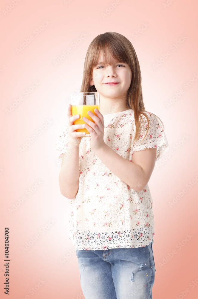 Cute girl drinking orange juice