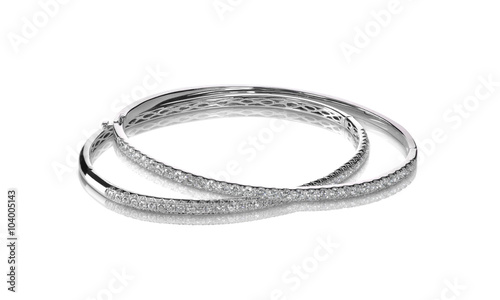 Set of diamond bracelets silver or white gold isolated on white with a shadow and reflection