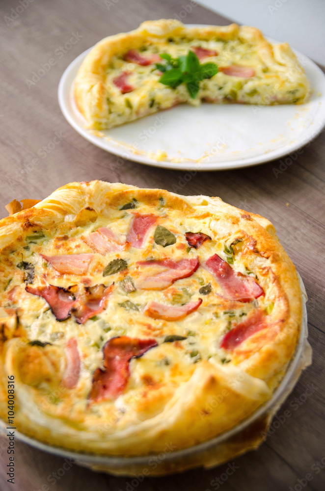Homemade Spinach and Bacon Egg Quiche in a pie crust. French cuisine Homemade Spinach and Bacon Egg Quiche in a pie crust. French cuisine