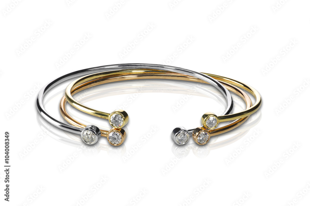 Set of three colored gold and diamond bracelets stacked Set of three colored gold and diamond bracelets stacked