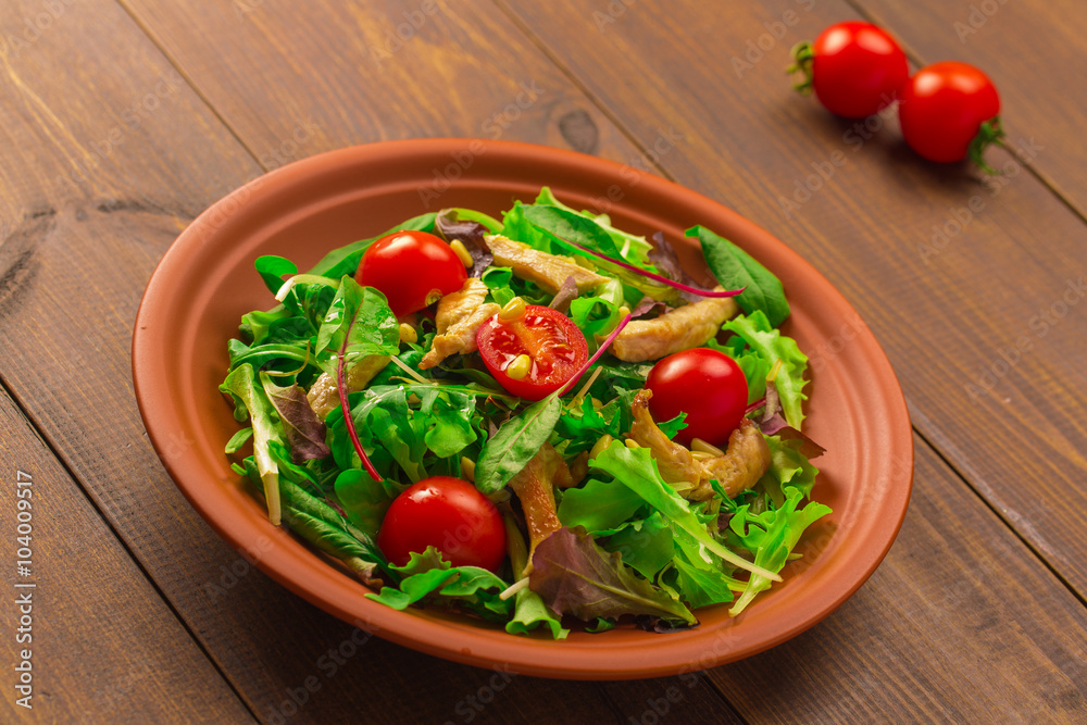 Fresh salad with chicken breast, arugula and tomato. Fresh salad with chicken breast, arugula and tomato.