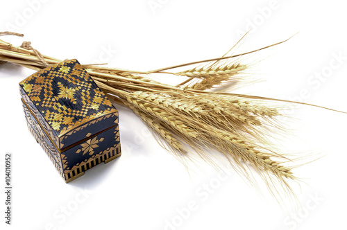 Photography yellow casket and grain ears, isolate