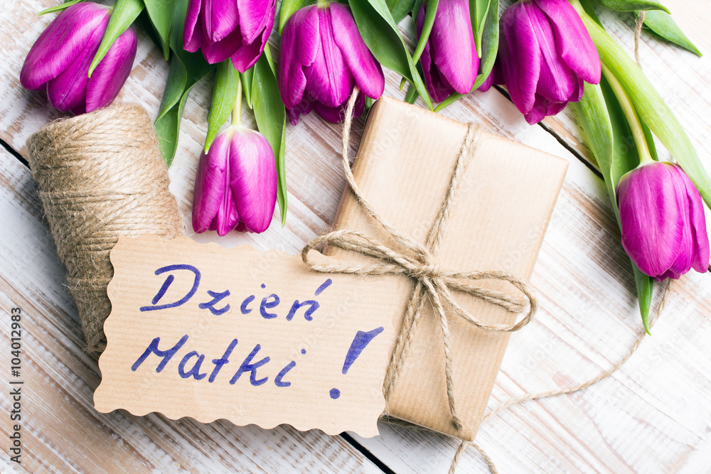 Mother's Day card and a bouquet of beautiful tulips on wooden background, with Polish words "Mother's Day" - obrazy, fototapety, plakaty 