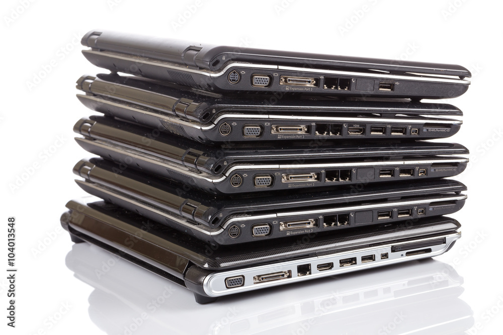 stack of old laptops awaiting repair stack of old laptops awaiting repair
