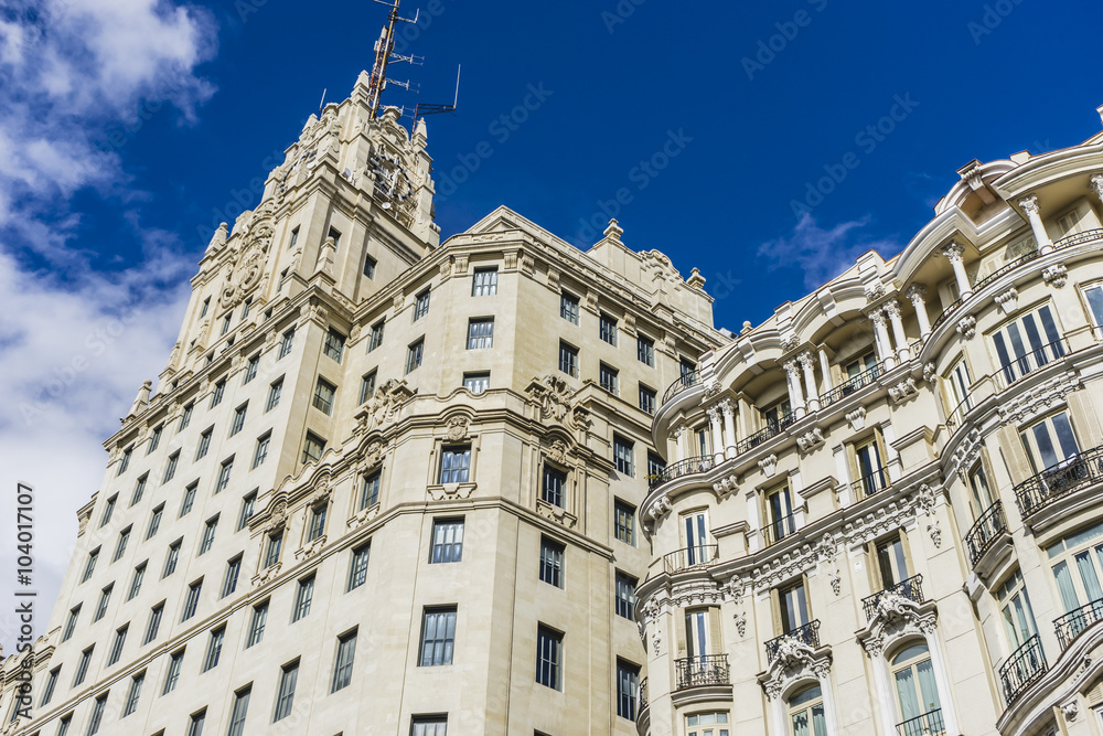 Fototapeta premium characteristic buildings on the street Gran Via in Madrid, capit