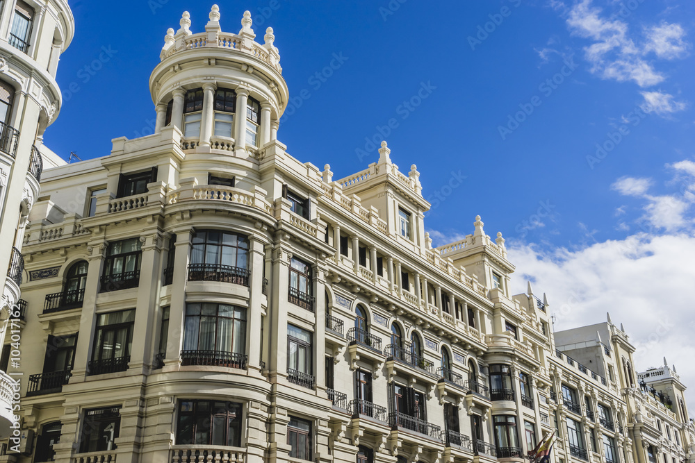 Naklejka premium characteristic buildings on the street Gran Via in Madrid, capit