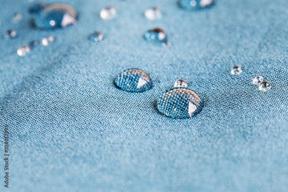 Waterprof fabric /  Detail of a water drop on fabric - obrazy, fototapety, plakaty 