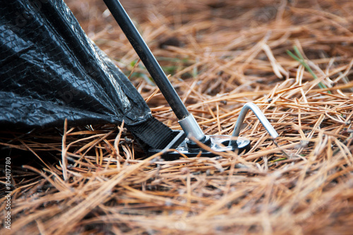 Placement of tent – peg and hoop.