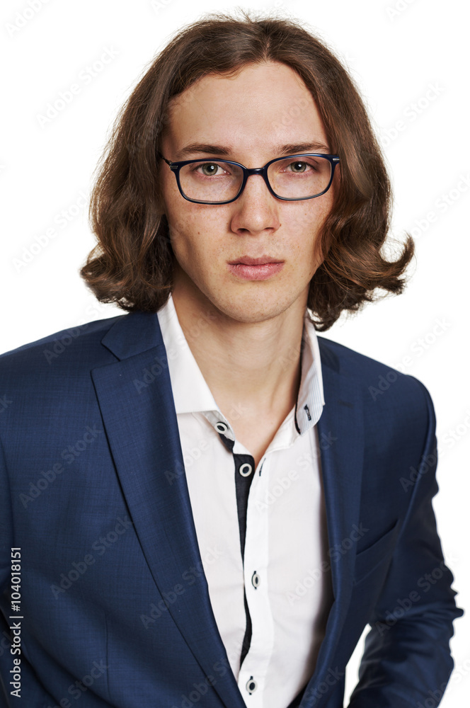 Portrait of a young man in a blue suit and glasses Portrait of a young man in a blue suit and glasses