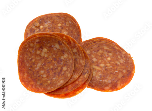 Slices of pepperoni on a white background.