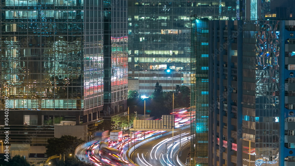 Top view of busy traffic night in finance urban timelapse, hong kong city