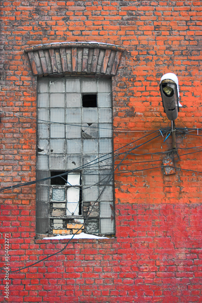 Old factory wall with window. The old architecture of Saint Petersburg city, Russia