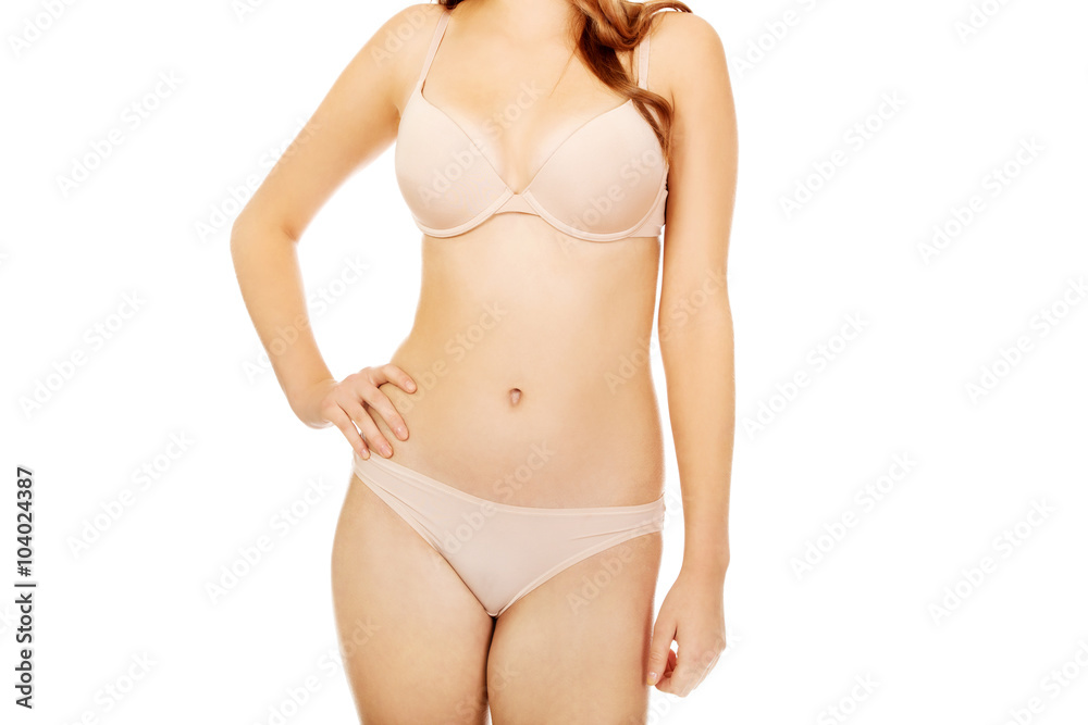 Body of teenage woman in beige underwear Body of teenage woman in beige underwear