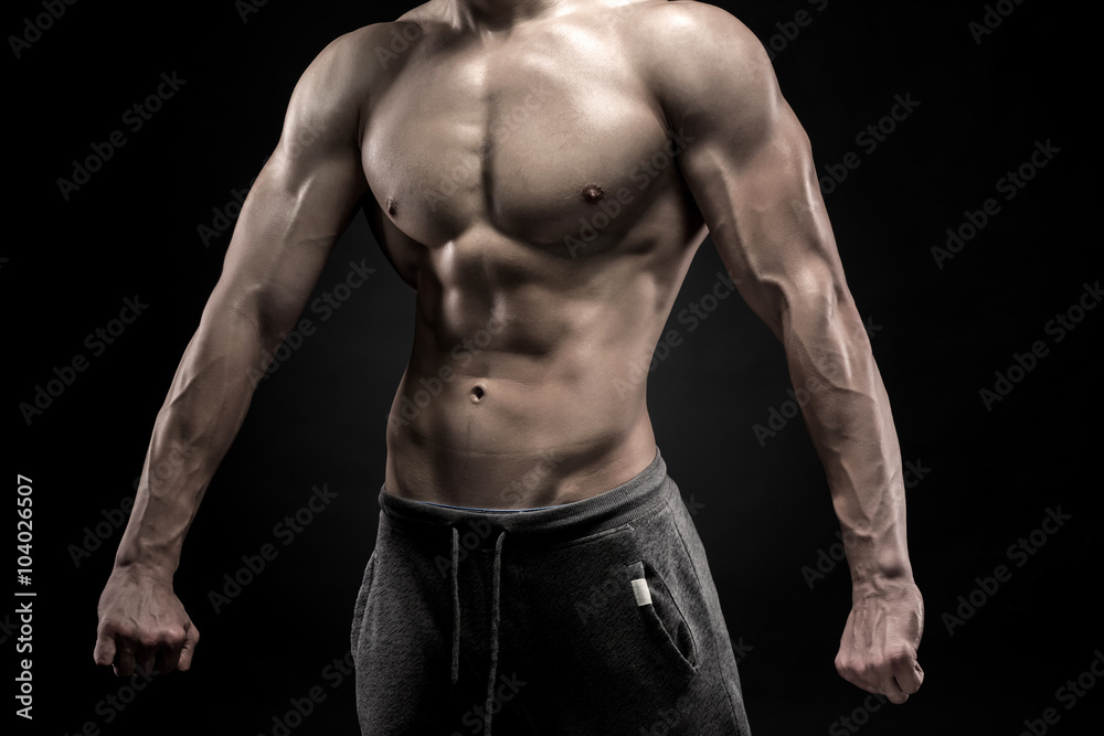 Close-up of man model torso posing showing perfect body Close-up of man model torso posing showing perfect body