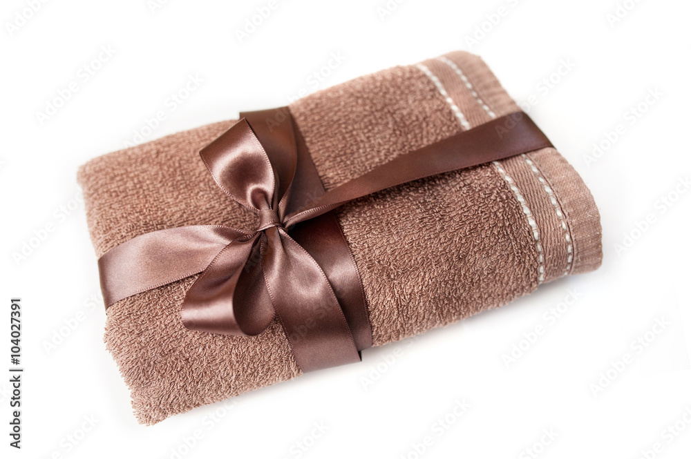 brown towel tied with a ribbon and bow brown towel tied with a ribbon and bow