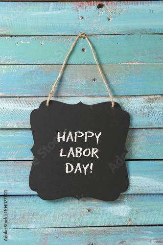 Labor Day chalk sign on blue wood background