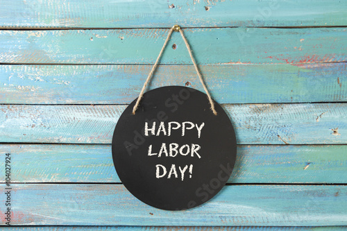 Labor Day chalk sign on blue wood background