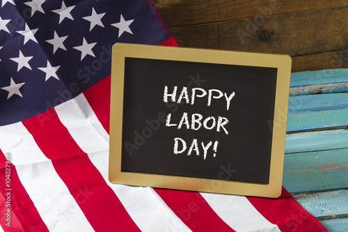 Labor Day chalk sign on blue wood background