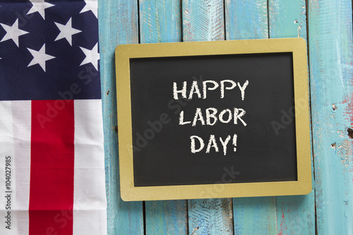 Labor Day chalk sign on blue wood background