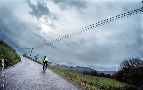 cyclist training under the rain. Pov, original point of view