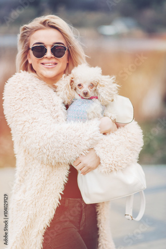 young caucasian cute girl portrait with dog outdoor in park walking happy and smile all the way 