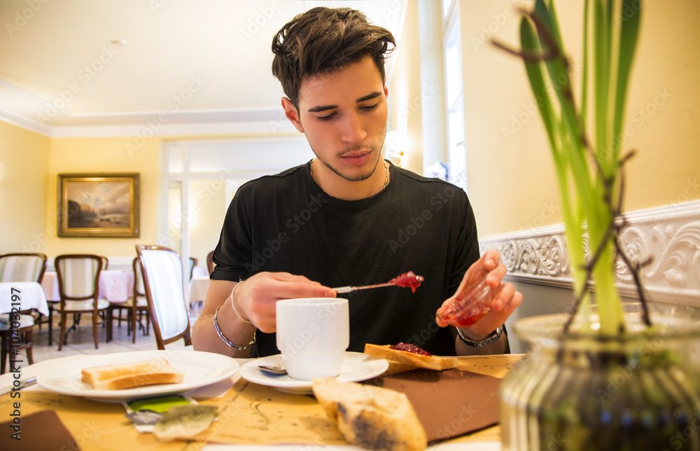 Attractive Young Man Eating Breakfast Attractive Young Man Eating Breakfast