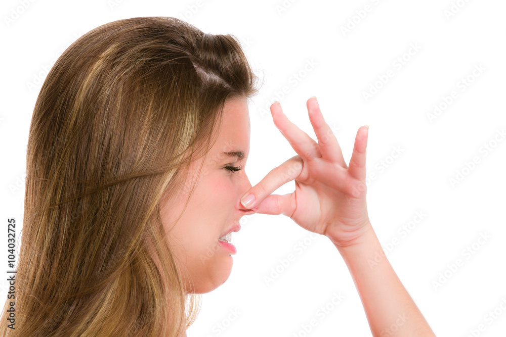 Disgunting and unpleasant smell. Hispanic young woman. Expression series. Disgunting and unpleasant smell. Hispanic young woman. Expression series.