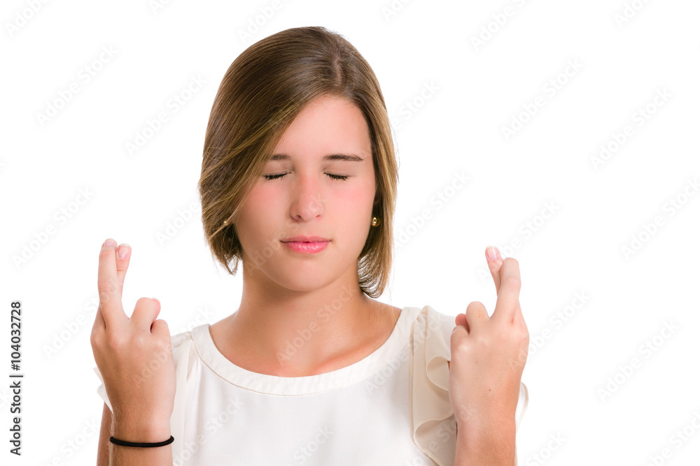 Hispanic young woman wishing luck with fingers crossed Hispanic young woman wishing luck with fingers crossed