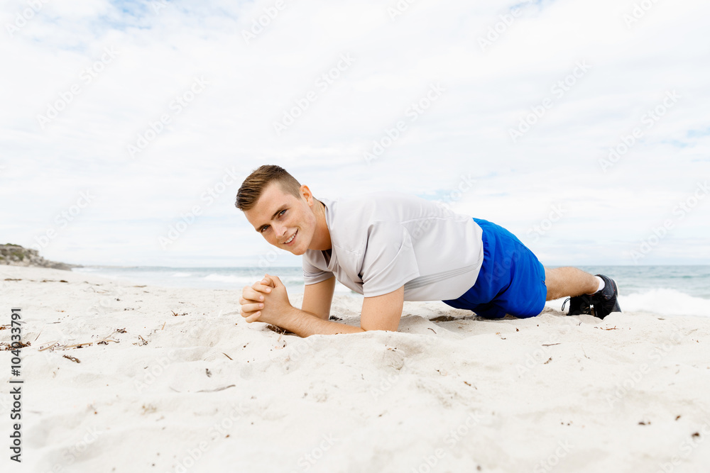 Man training on beach outside Man training on beach outside