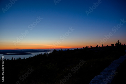 Silhouette of people at Cadillac Mountain during Sunrise photo