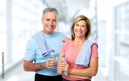 Senior couple with bottle of water.