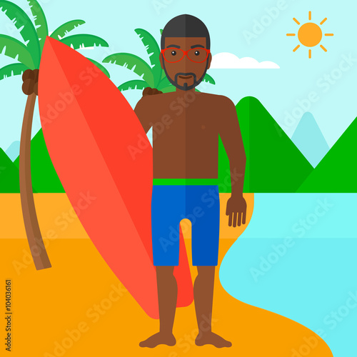 Surfer holding surfboard.