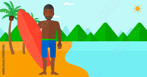 Surfer holding surfboard.