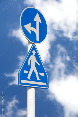 Traffic sign at street and blue sky background