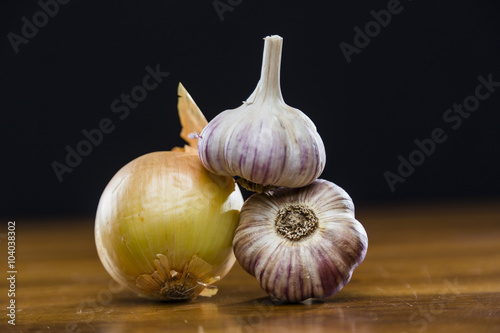 Onion Garlic and Ginger on Dark Background