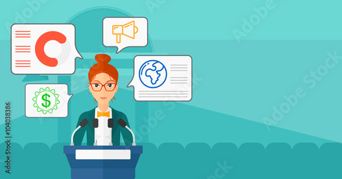 Woman speaking on podium.