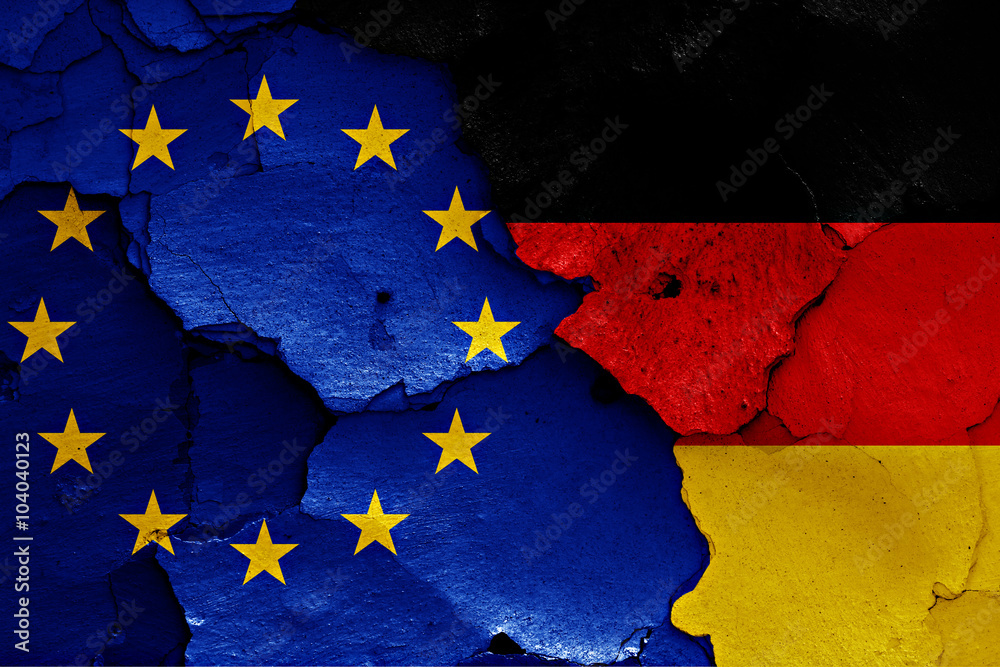 flags of EU and Germany painted on cracked wall flags of EU and Germany painted on cracked wall