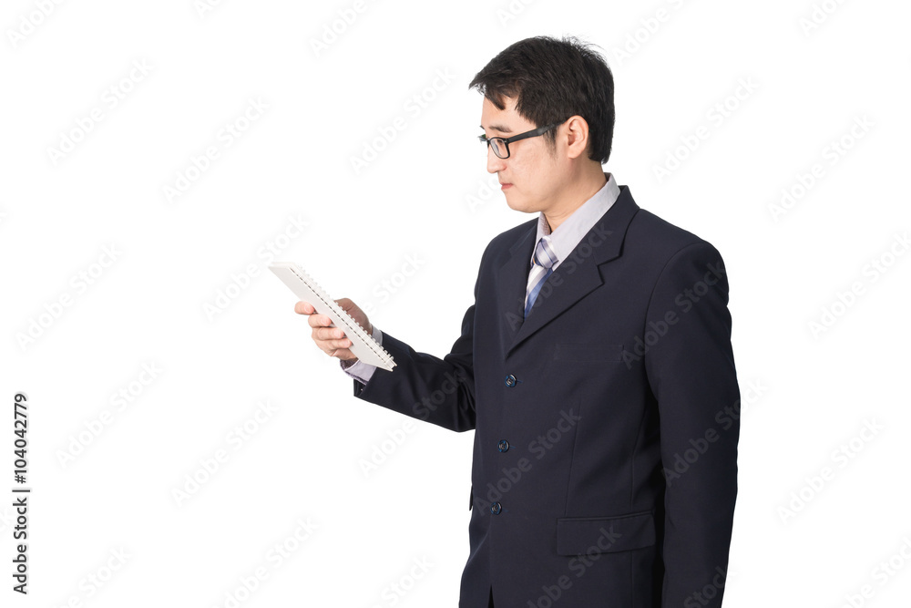 Asian businessman reading notebook or diary for checking, isolat Asian businessman reading notebook or diary for checking, isolat
