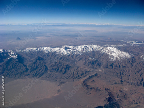 Mountains on clear blue sky aerial view © Yozhik