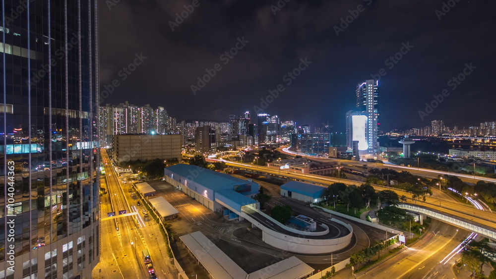 Top view of busy traffic night in finance urban timelapse hyperlapse with panorama of city buildings, hong kong city Top view of busy traffic night in finance urban timelapse hyperlapse with panorama of city buildings, hong kong city