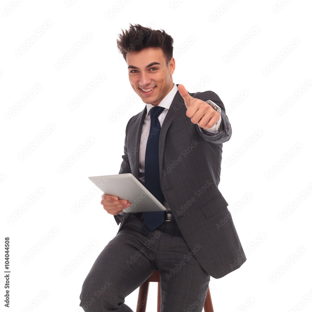 business man holding tablet and making the ok sign business man holding tablet and making the ok sign